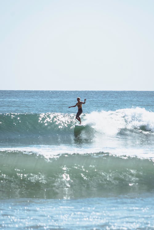 A Person Surfing on the Sea