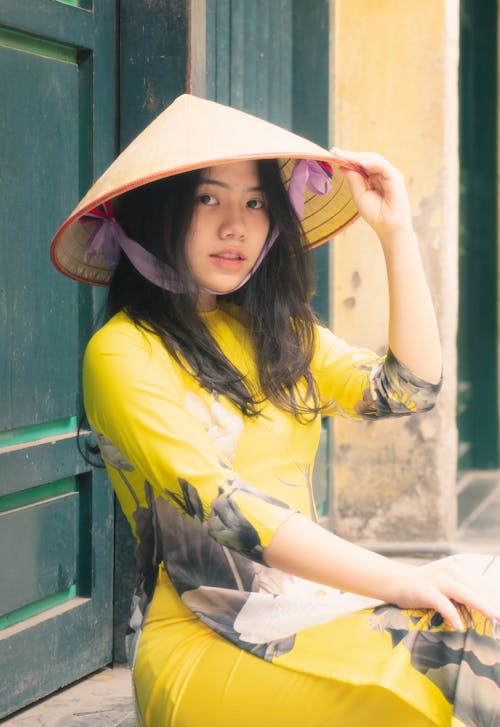 Woman in Yellow Dress Wearing a Hat