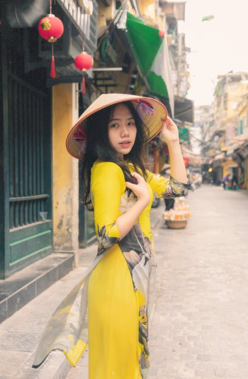 A Pretty Woman in Yellow Dress Wearing a Hat