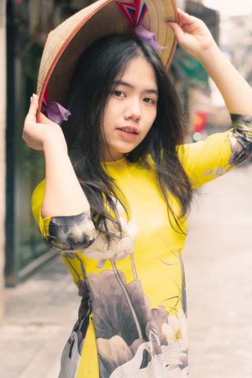 A Pretty Woman in Yellow Dress Wearing a Hat