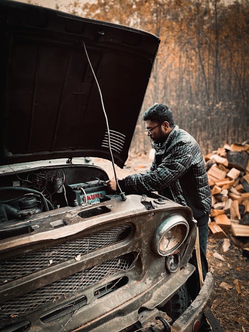 A Man Fixing a Car