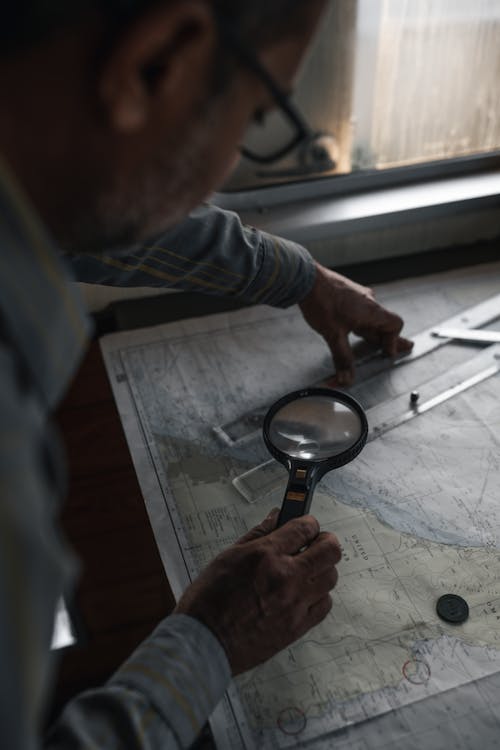 Man Measuring on Map