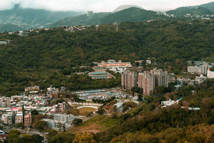 Panoramic View Of City And Old Chinese Temple In Mountains