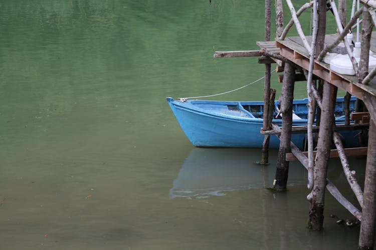 Boat Moored By Wooden Pier