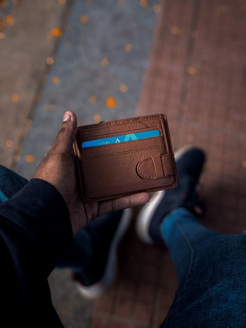 Man Holding Brown Leather Wallet 