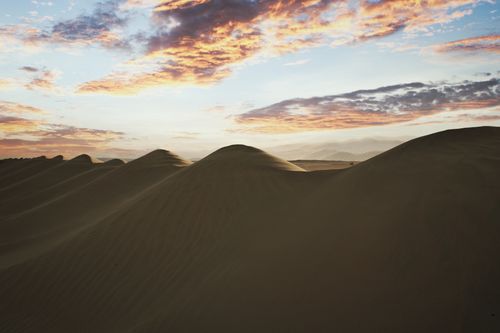Free Captivating sunrise over sand dunes in the UAE desert, showcasing natural beauty and tranquility. Stock Photo