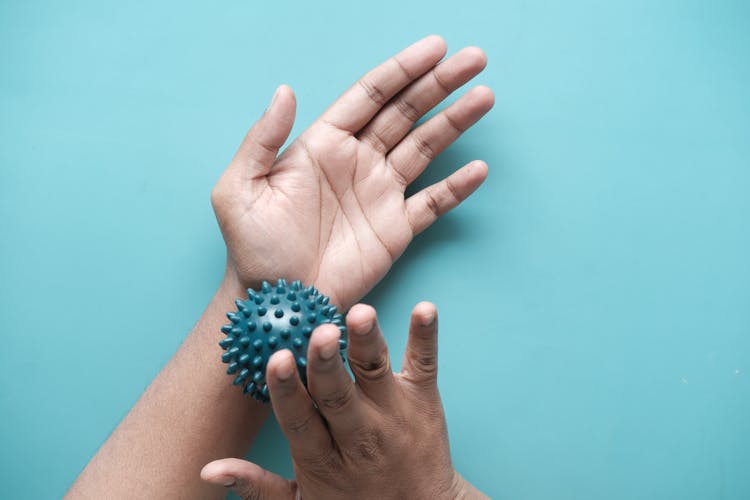 Hands With Massage Ball