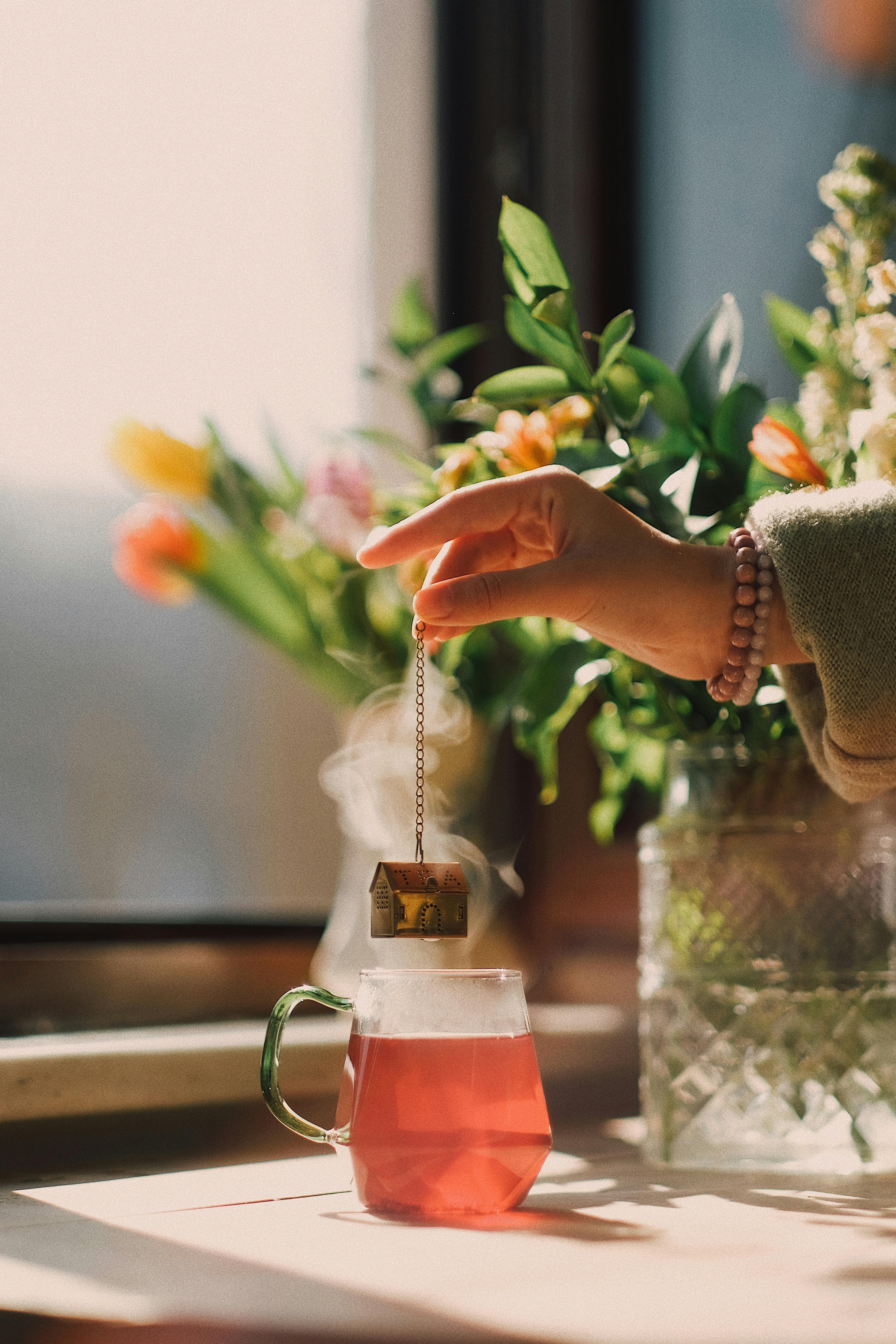 hand brewing tea in glass