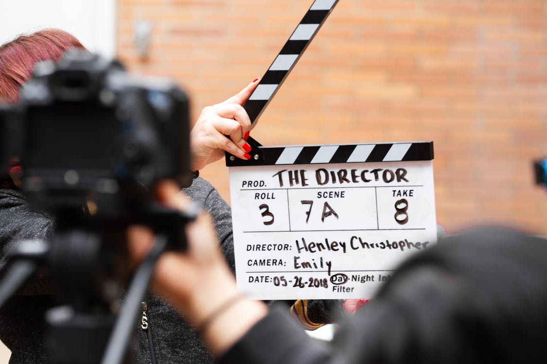 Free Man Holding Clapper Board Stock Photo