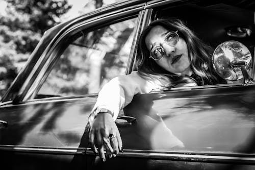 Woman with Cigarette in Classic Car
