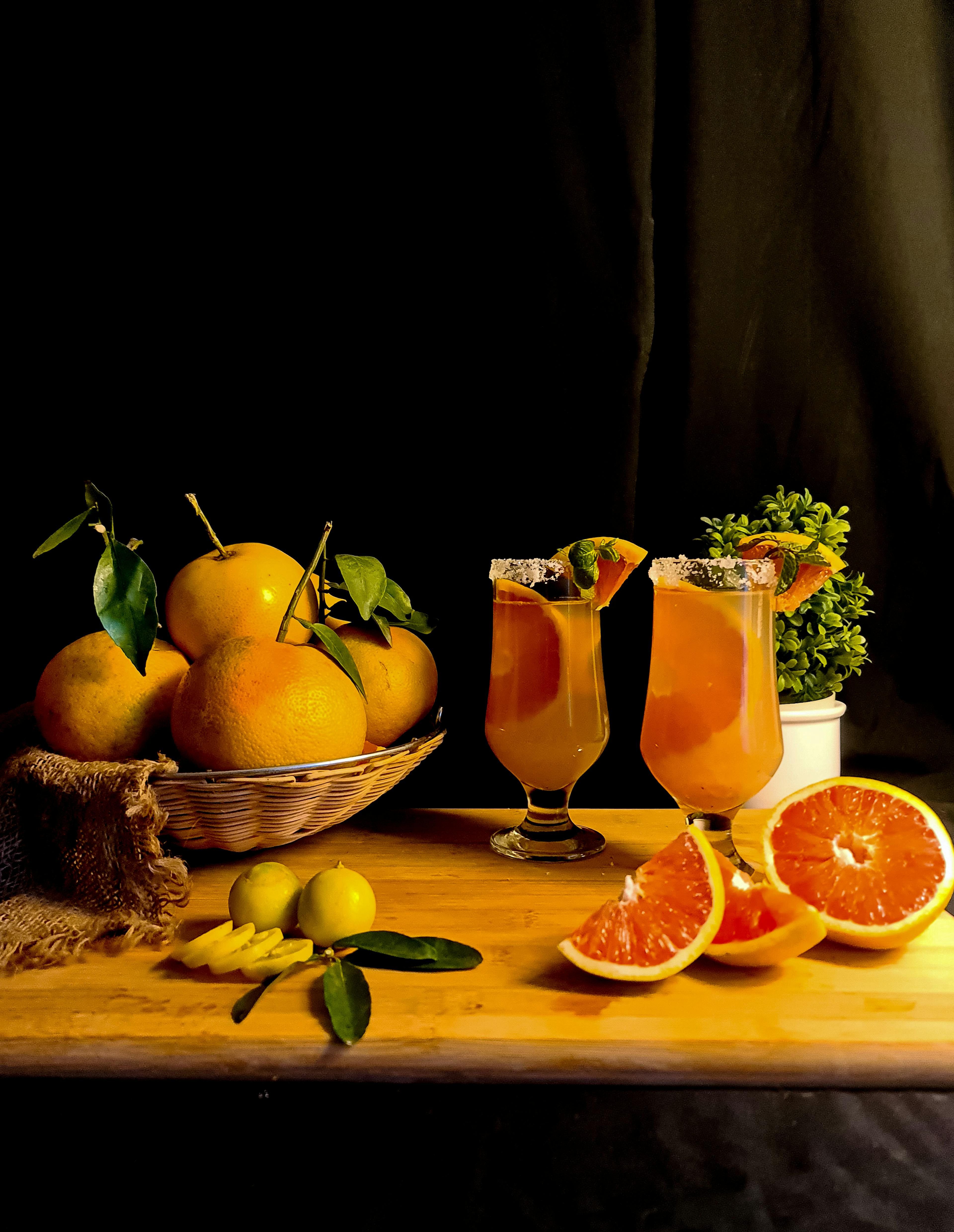 Orange Juice in Drinking Glasses on Brown Wooden Table