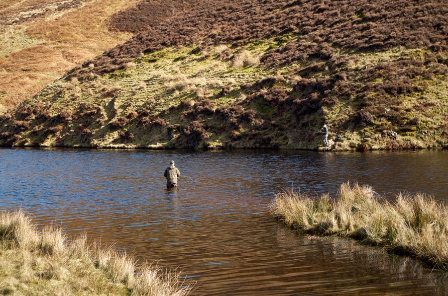 Drift boat water: an angler casting from a canyon run