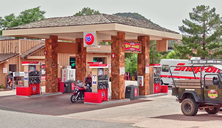 Vehicles Refuelling At Gas Station