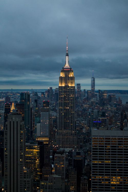Free A breathtaking shot of New York City skyline featuring the iconic Empire State Building at night. Stock Photo