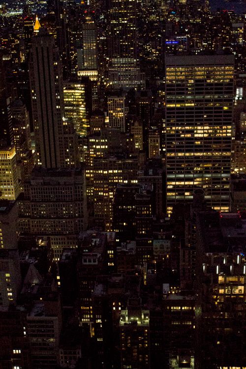 Free Captivating aerial night view of New York City's illuminated skyscrapers, showcasing vibrant city life. Stock Photo