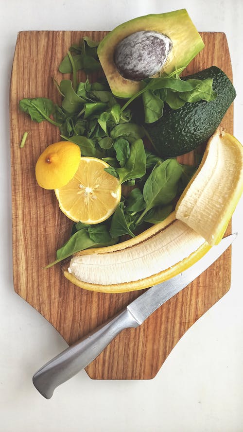 Free Fruits and Herbs on Wooden Chopping Board Stock Photo