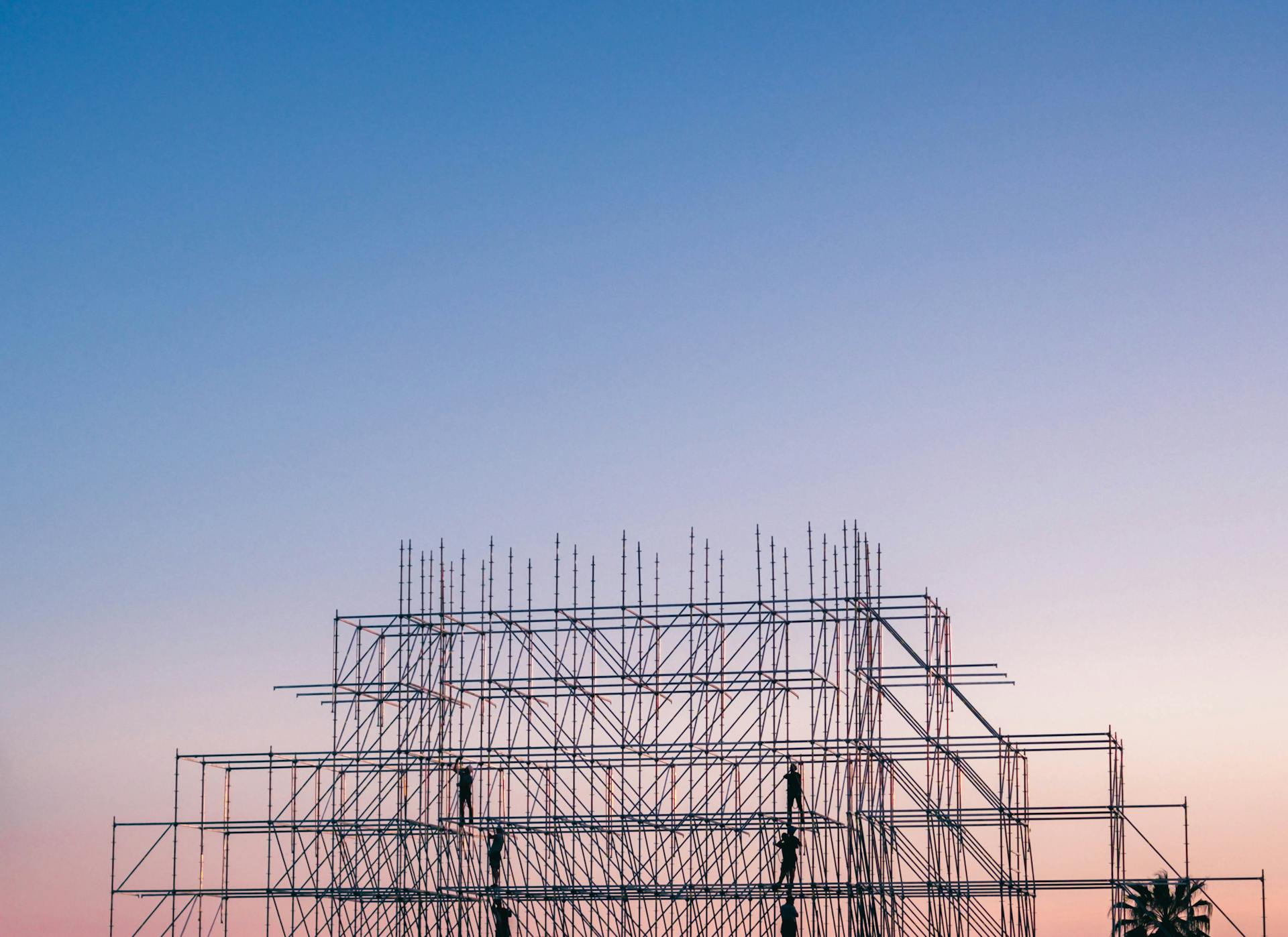 Photo of People on Building Under Construction