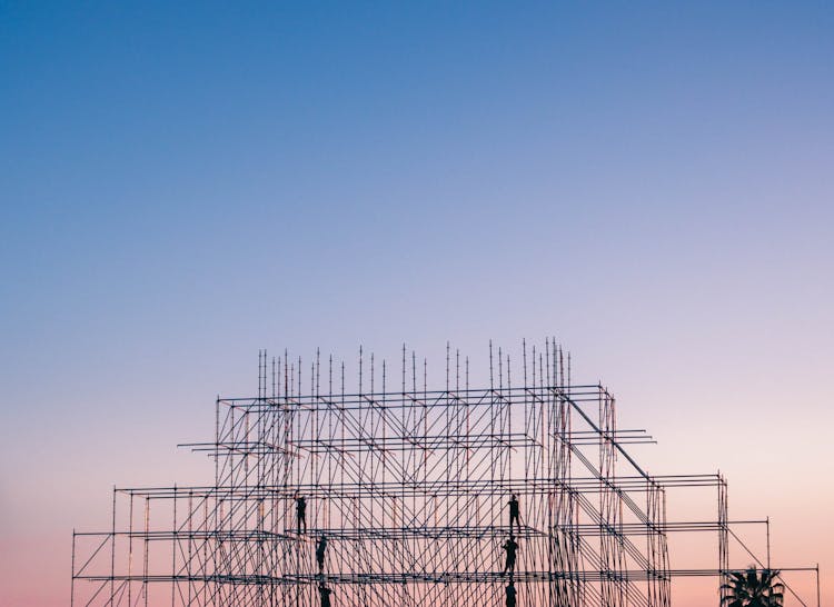 Photo Of People On Building Under Construction