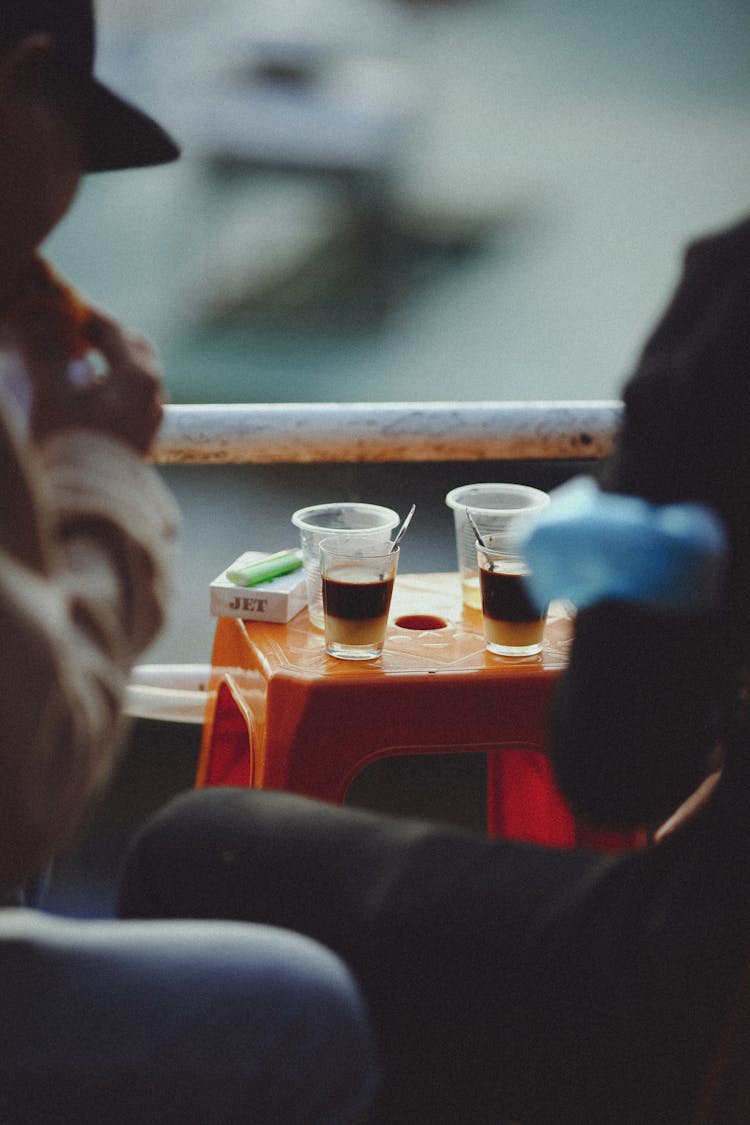 People And Coffee On Stool On Street