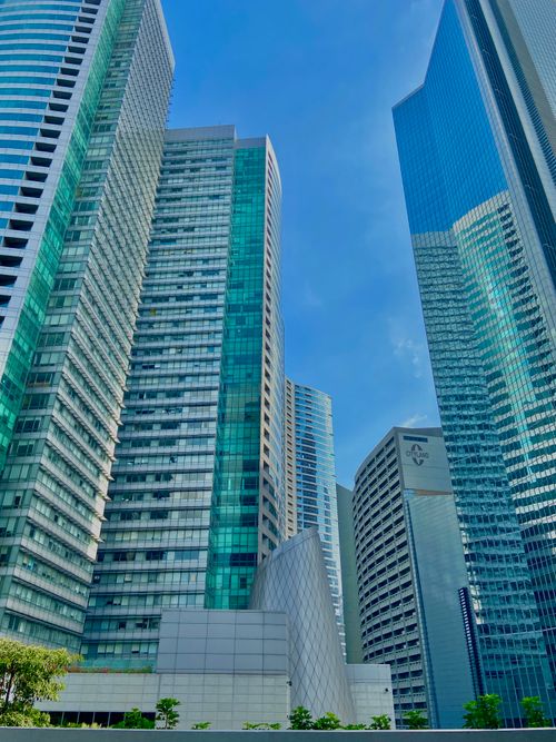 Free Tall skyscrapers in bustling Makati, Philippines under a clear blue sky. Stock Photo