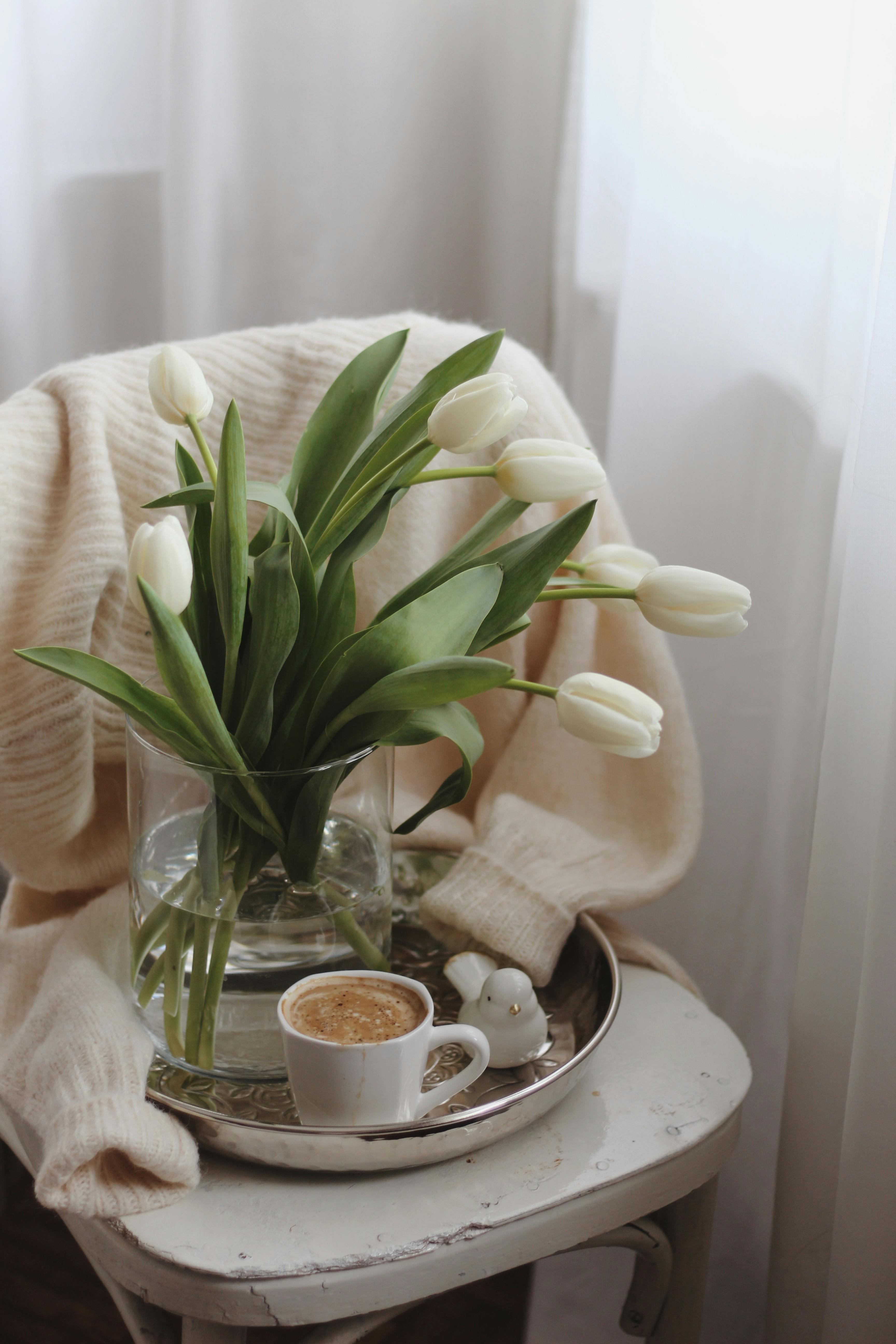 Open Book With Cup of Coffee and Flowers on Sweater · Free Stock Photo