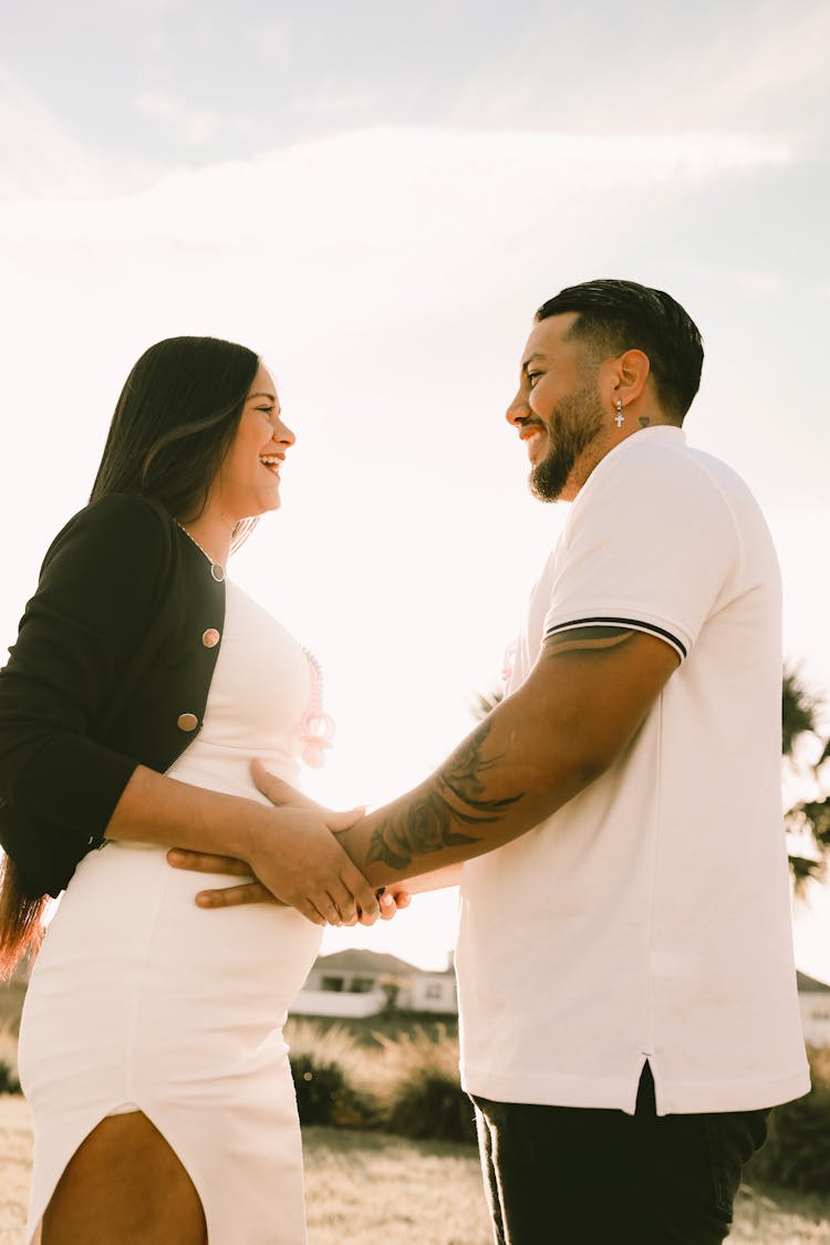 Man Holding Pregnant Woman Belly