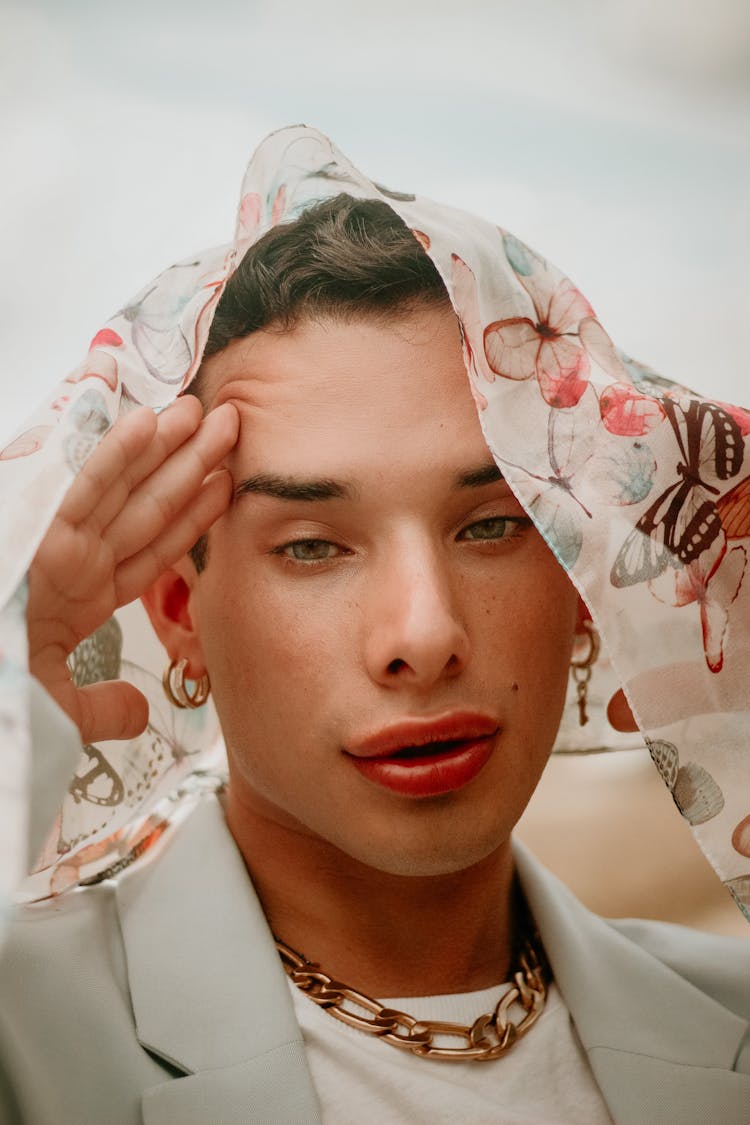 Portrait Of Man Wearing Floral Veil On Head