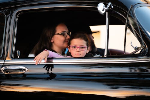Free Woman and Child Inside Car Stock Photo
