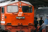 Close-up of an Orange Train with Graffiti