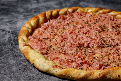 Close-up of Pizza on Marble Surface 