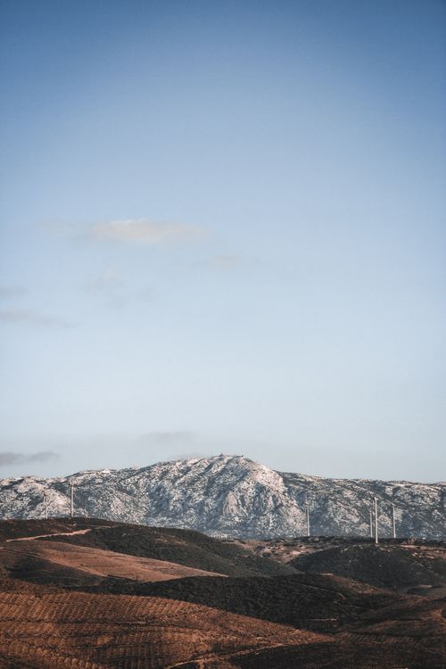 Free A tranquil winter mountain scene featuring wind turbines near Izmir, Turkey. Stock Photo