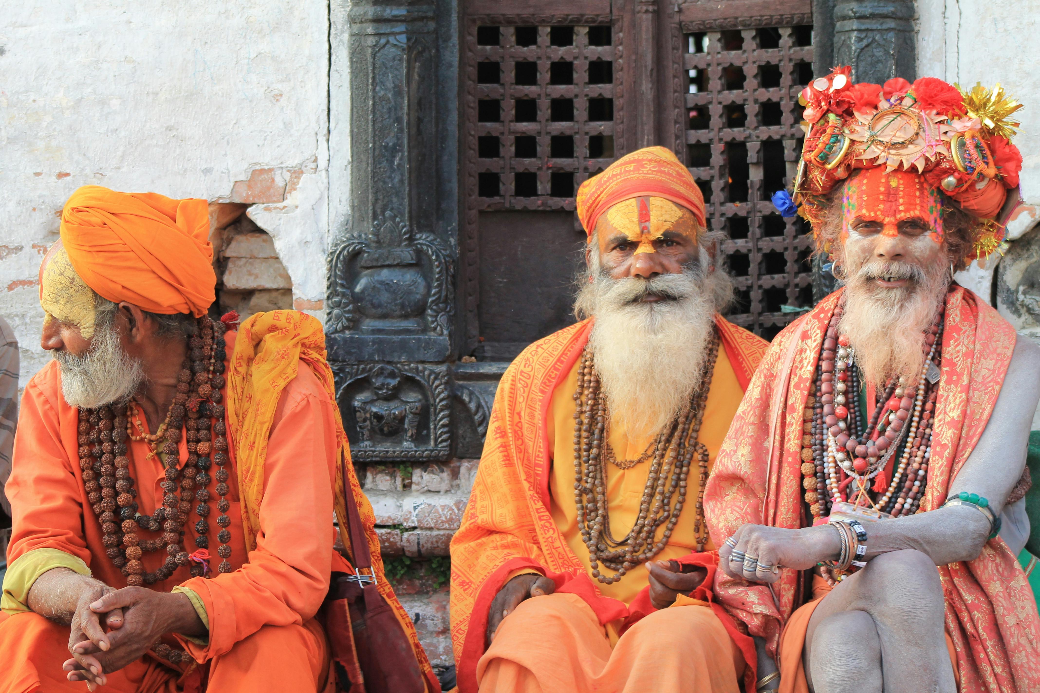 Free Three Men Wearing Orange Tradition Clothes Stock Photo