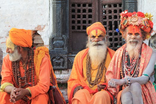 Three sadhus in traditional attire at Pashupatinath Temple, Nepal, exemplifying vibrant cultural heritage.