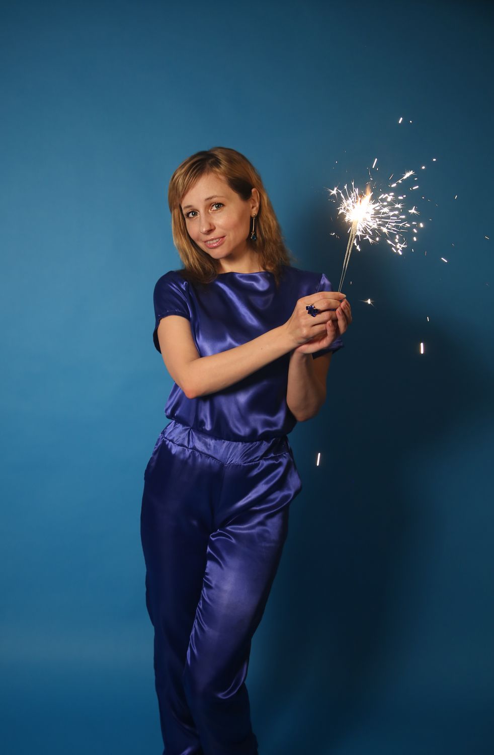 A Woman Holding a Sparkler · Free Stock Photo