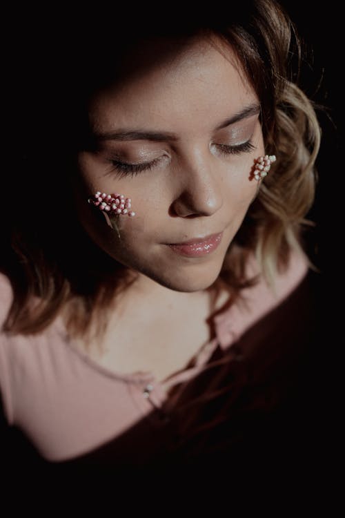 Free Young Female Face Decorated with Dry Buds of Tiny Flowers Stock Photo
