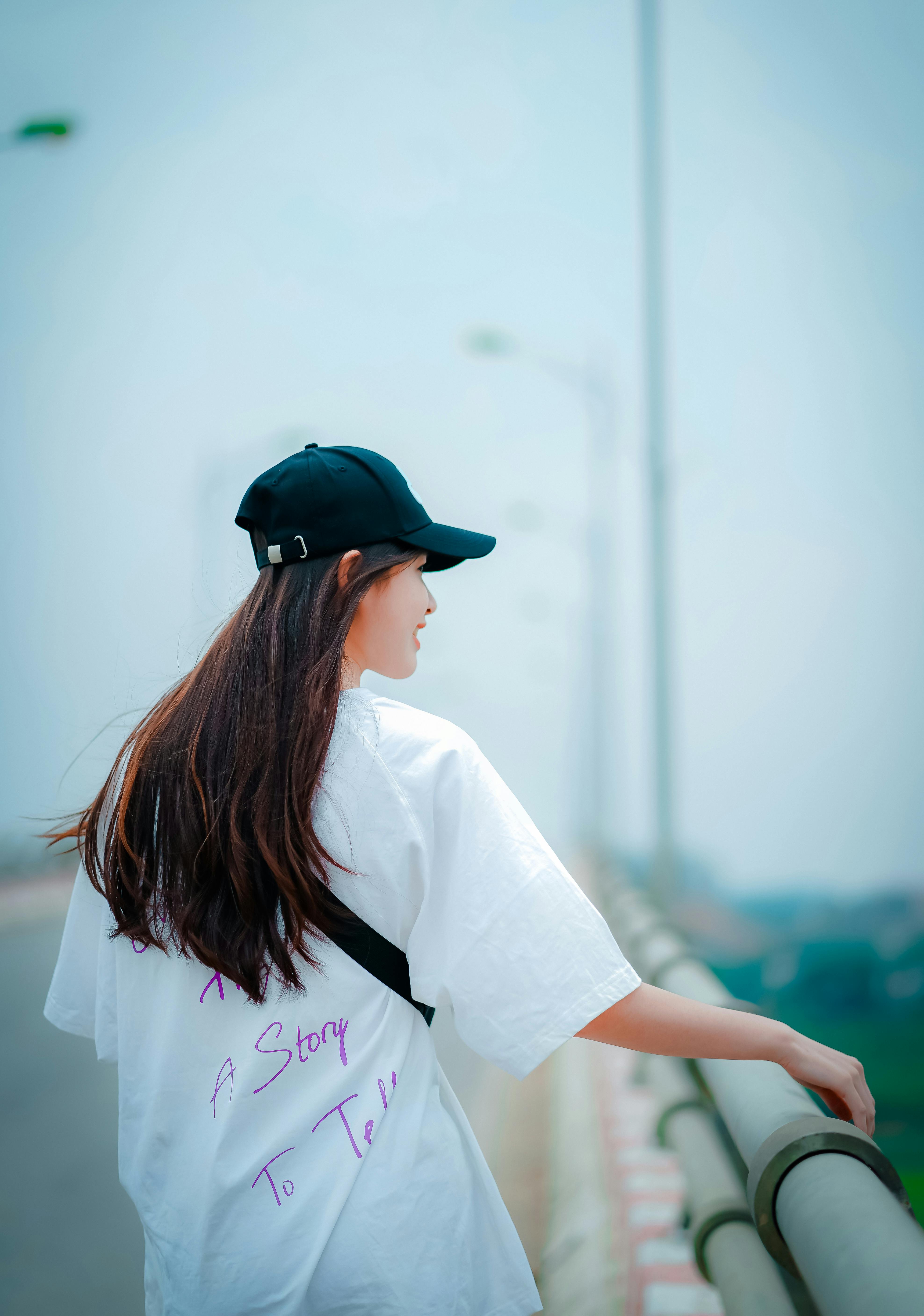 Woman in White Shirt Wearing a Cap · Free Stock Photo Woman in White Shirt Wearing a Cap · Free Stock Photo