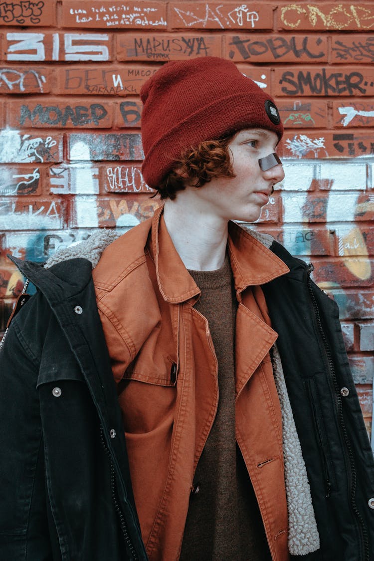 Teenage Boy Redhead With Band Aid On Nose