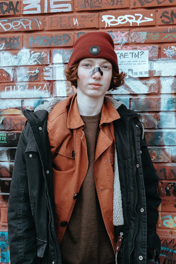 Teenage Boy Redhead With Band Aid On Nose