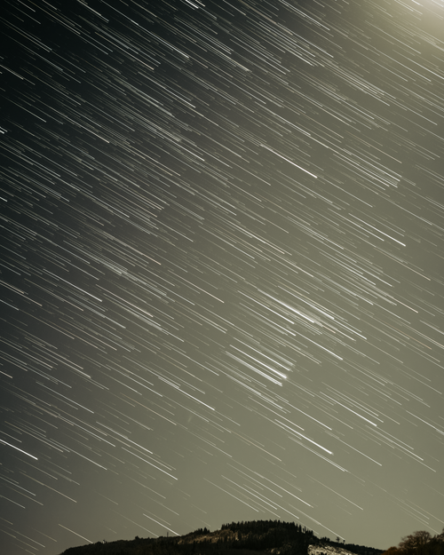 Free Dramatic long exposure of star trails above Ilmenau, Germany, at night. Stock Photo