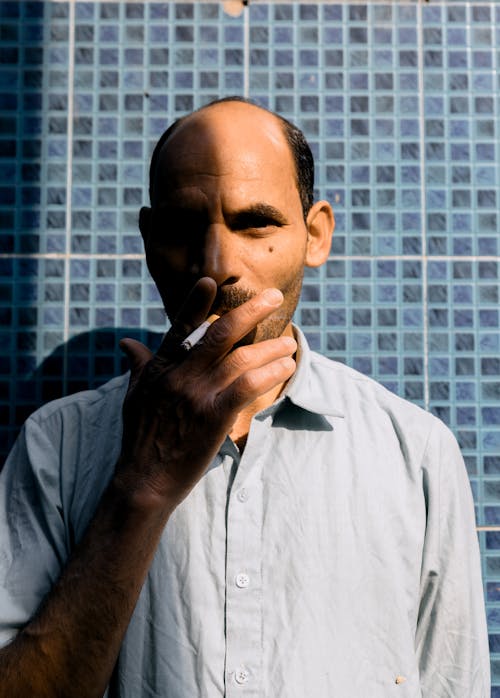 Free A Man Smoking a Cigarette  Stock Photo