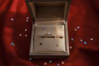 Gold Ring on Gray Box