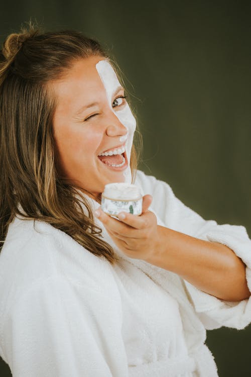 Free A Woman Holding a Beauty Product Stock Photo