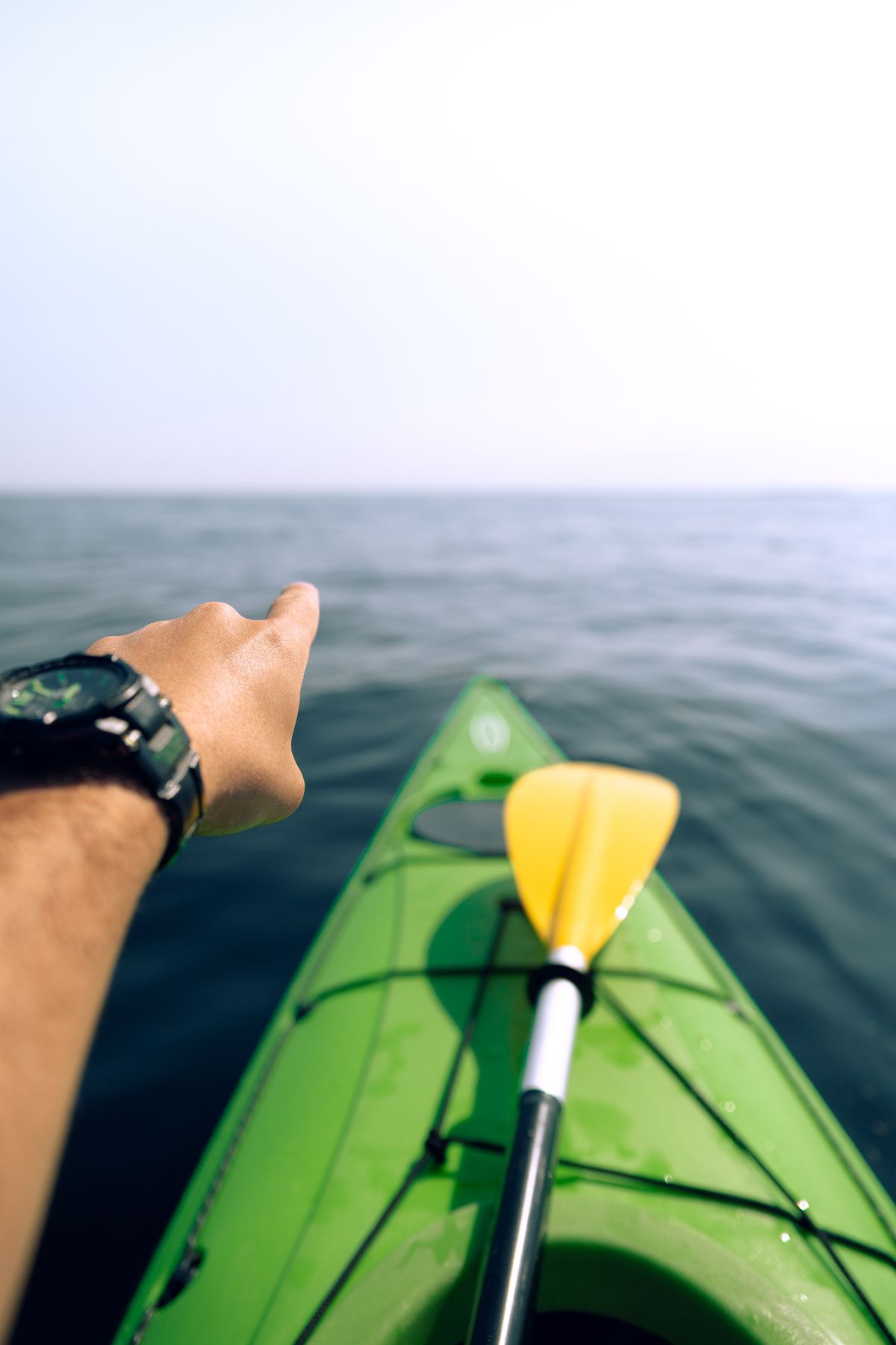Point of view from a green sea kayak looking out over open water