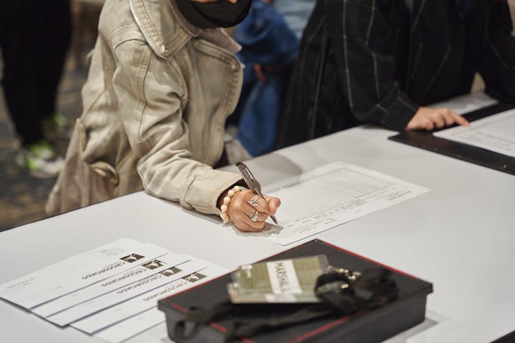 Closeup Of People Signing Lists