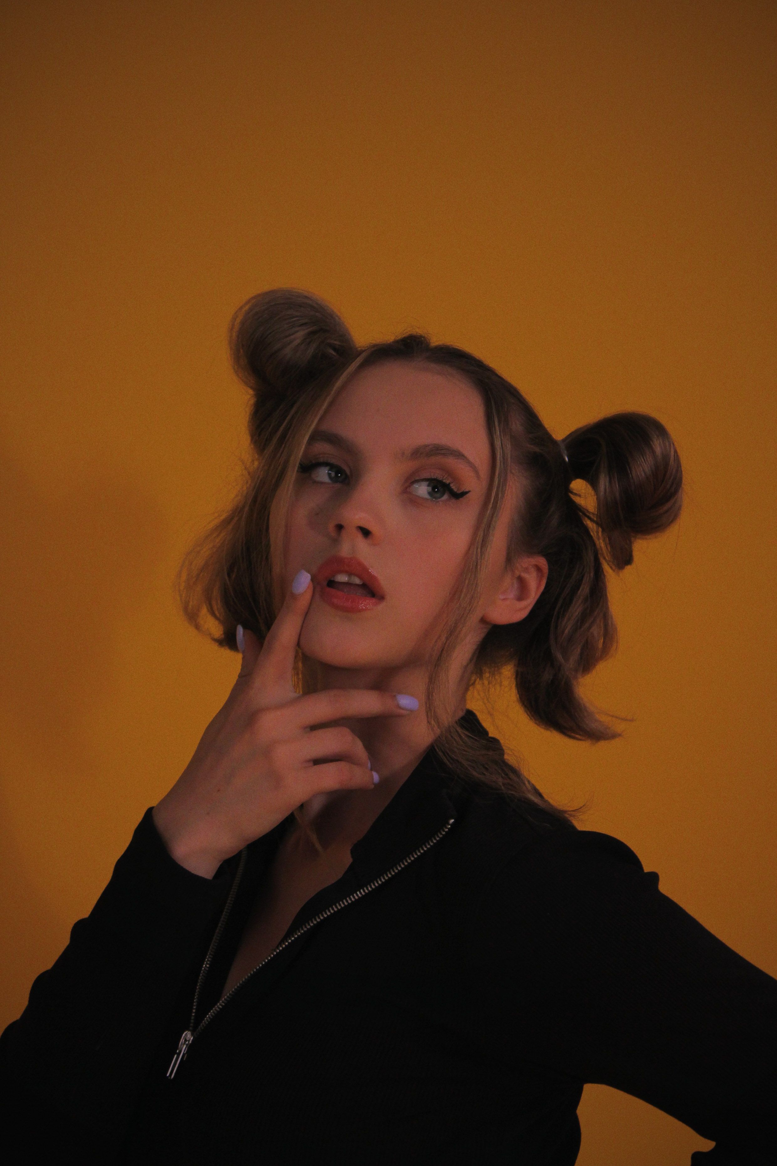 Half up space buns party hairstyle