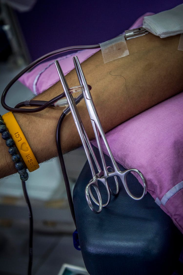 Surgical Forceps Clipped On A Catheter