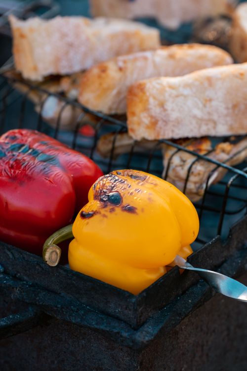 Free Close-up of grilled bell peppers and ciabatta bread on an outdoor barbecue grill. Stock Photo
