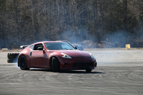 Red Sports Car Drifting on the Road