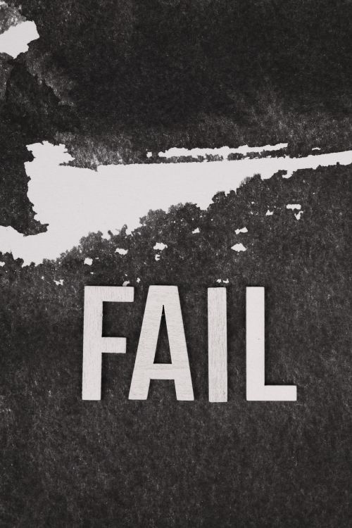 Free Black and white image with bold 'FAIL' text on a textured background. Stock Photo