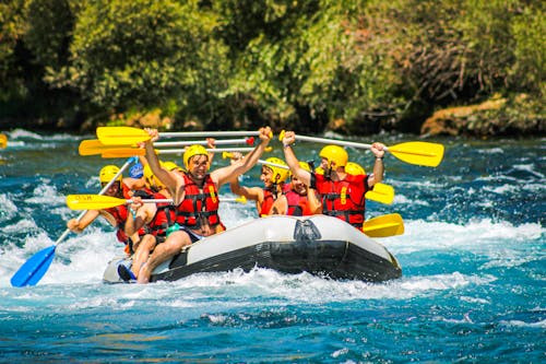 Free People Riding on Inflatable Raft Stock Photo